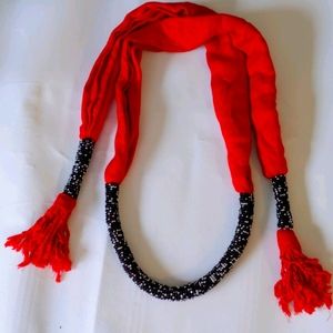 Red and black textile necklace from Kenya